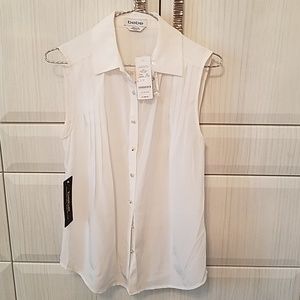 White silk sleeveless bebe blouse